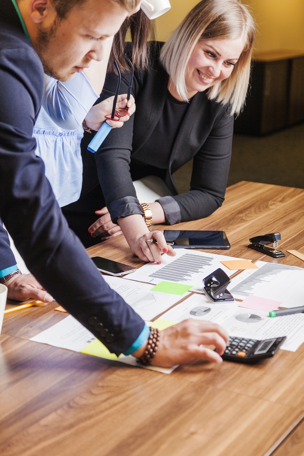 people-leaning-desk-standing